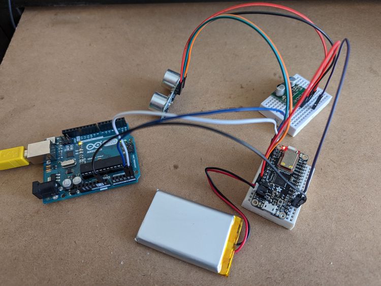 I2C communication between Arduino Uno and Feather 32u4 with a distance sensor